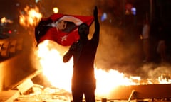 A Turkish man protests against the government of Erdoğan.