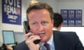 David Cameron helps staff the remain campaign phone lines earlier this month.