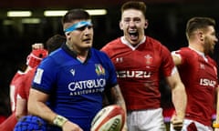 Wales’ Josh Adams celebrates scoring their fifth try to complete his hat-trick.