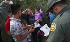 Border Patrol agents take a group of Central American migrants into custody.
