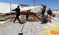 A group of men sets up a makeshift camp in Moulay Brahim, south of Marrakech, Morocco