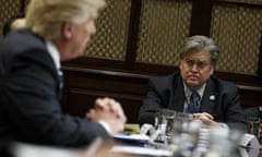 Steve Bannon listens as Donald Trump speaks during a meeting shortly after he took office.