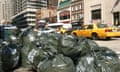 Piles of black bin bags on a New York street