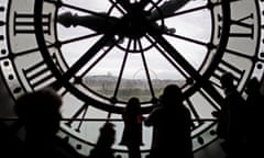 Visitors at the Musee d'Orsay are seen in silhouette as they look behind a giant clock face at the former Orsay railway station in Paris<br>Visitors at the Musee d'Orsay are seen in silhouette as they look behind a giant clock face at the former Orsay railway station, in Paris, France, July 28, 2015. The national museum of the Musee d'Orsay opened in December 1986 and it displays collections of art from the period 1848 to 1914. France has been the world's most visited country since the 1980's, welcoming 84 million tourists last year. REUTERS/Stephane Mahe