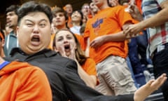 Minyong Kim<br>In this Oct. 9, 2015 photo, University of Illinois senior Minyong Kim, who has parlayed his resemblance to North Koreas Kim Jong Un into a part-time hobby, part-time acting career, reacts with the Spike Squad during an Illinois/Penn State volleyball match on the university campus in Champaign, Ill. (Robin Scholz/The News-Gazette via AP) MANDATORY CREDIT