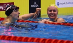 Ariarne Titmus (right) reacts after beating Katie Ledecky to gold