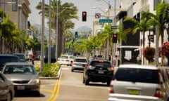 Cars drive down Rodeo Drive in Beverly Hills