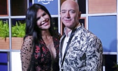 Jeff Bezos,Lauren Sánchez<br>FILE - In this Jan. 16, 2020, file photo, Amazon CEO Jeff Bezos, right and his girlfriend Lauren Sanchez poses for photographs during a blue carpet event organized by Amazon Prime Video in Mumbai, India. Michael Sanchez, the brother of Jeff Bezos’s girlfriend, is suing the Amazon founder for defamation, alleging that Bezos and his team falsely told reporters that he provided nude photos of Bezos to the The National Enquirer. (AP Photo/Rafiq Maqbool, File)