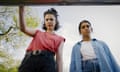 Margaret Qualley and Geraldine Viswanathan in Drive-Away Dolls seen from below, opening the boot of a car