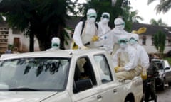 Hygiene officials prepare to disinfect an area after the removal of dead bodies – victims of the Marburg virus – at the Uige Provincial Hospital, Angola, 15 April 2005