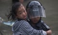 TPolice officers rescue a child from a flooded street during Typhoon in Lei Yu Mun, Hong Kong