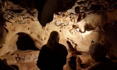 Scientists discuss the markings on the walls of a cave in La Roche-Cotard in the Loire valley.