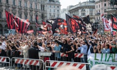 People gather in Piazza del Duomo in Milan as they wait for the coffin of Silvio Berlusconi to arrive for his state funeral on Wednesday.