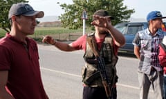 Armed men from the village of Kyzyl-Bel on a road in Kyrgyzstan’s south-western Batken region  during the fighting along the Kyrgyz-Tajik disputed border.