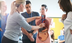 Lecturer speaking to college students in human anatomy class