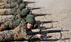 The Wider Image: Training Afghanistan’s women soldiers<br>Sabera, 23, a soldier from the Afghan National Army (ANA) gestures during a shooting exercise at the Kabul Military Training Centre (KMTC) in Kabul, Afghanistan October 26, 2016. REUTERS/Mohammad Ismail SEARCH “KABUL TRAINING” FOR THIS STORY. SEARCH “THE WIDER IMAGE” FOR ALL STORIES.