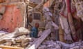 A man searches for his belongings in the remains of his house in Amizmiz, a city about 35 miles from the earthquake epicentre in Morocco.