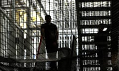Men in prison in silhouette