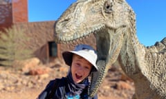Sally Dillon’s son with a dinosaur sculpture at the Australian Age of Dinosaurs museum in Winton, central Queensland