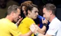 A disappointed Alex de Minaur shakes hands with Jannik Sinner after the Italian won their singles match in the Davis Cup final. 