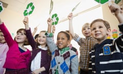 children holding recycling signs