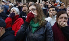 Supporters cover their mouths during a protest by doctors and allied health professionals in Sydney to oppose the secrecy provisions of the Border Force Act, in July 2015. 