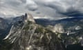 Mountain peak in grey clouds