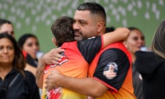 Lachlan Wright (right), father of Jai Wright, embraces supporters at the coroner's court in Sydney