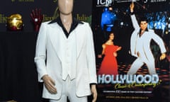 The white polyester suit and black shirt displayed on a mannequin