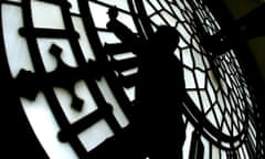 A worker inside  the clock face of St Stephen’s clock tower housing the Big Ben bell in London.