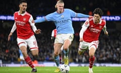 Arsenal attempt to take the ball off Erling Haaland at the Emirates Stadium