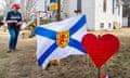 Aftermath of mass shooting, Nova Scotia, Canada - 26 Apr 2020<br>Mandatory Credit: Photo by Canadian Press/REX/Shutterstock (10625765e) People pay their respects at a roadside memorial in Portapique, N.S.. A man went on a murder rampage in Portapique and several other Nova Scotia communities killing 22 people. Aftermath of mass shooting, Nova Scotia, Canada - 26 Apr 2020