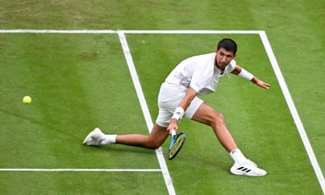 Alexei Popyrin returns the ball to Novak Djokovic.