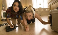 This image released by Lionsgate shows Kate McKinnon, right, and Mila Kunis, left ( Audrey) in a scene from "The Spy Who Dumped Me." (Hopper Stone/Lionsgate via AP)