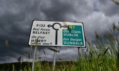 A road sign at a roundabout on the border between Northern Ireland and Ireland with directions to Belfast and Dublin is seen in Carrickcarnan, Ireland.