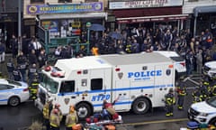 Emergency personnel gather at the entrance to a subway station in Brooklyn after the rush-hour shooting on 12 April. 