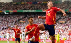 Spain's Dani Olmo, right, celebrates with Spain's Alvaro Morata after scoring his sides first goal during a quarter final match between Germany and Spain at the Euro 2024 soccer tournament in Stuttgart, Germany, Friday, July 5, 2024. (AP Photo/Manu Fernandez)