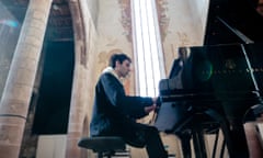 Alexandre Kantorow plays in the church of the Dominicains of Haute-Alsace, France, earlier this year.