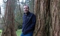 Scientist Phil Wilkes next to redwood trees at the Kew botanical gardens in Wakehurst, Sussex. 