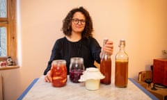 Dale Berning Sawa at her kitchen table with jars of her home-made fermented food.