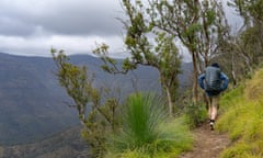 Rear view of a hiker walking along Scenic Rim Trail