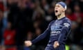 Phil Foden celebrates after the final whistle at the Wanda Metropolitano. 