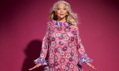 Asha Puthli posing for a portrait in a pink patterned dress