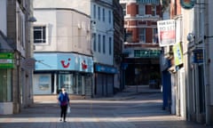 A woman walks through the town centre in Merthyr Tydfil