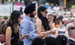 New citizens take a pledge at a Canberra citizenship ceremony on January 26, 2022.