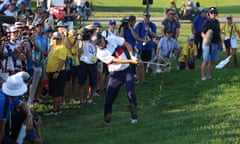 USA’s Jordan Spieth chips onto the 15th green from the rough during the fourballs