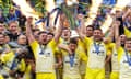 Gregory Alldritt and Romain Sazy of La Rochelle lift the Champions Cup trophy after the team's victory over Leinster.