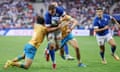 Michele Lamaro makes a break to score Italy's second try during the World Cup match against Uruguay