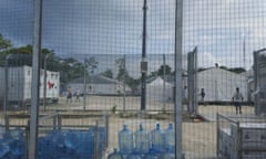 Detainees walk around inside the Manus Island detention centre in Papua New Guinea.