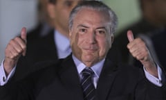 Brazil’s president, Michel Temer, gives the thumbs up as he leaves hospital before the key vote on whether he should be tried for corruption.